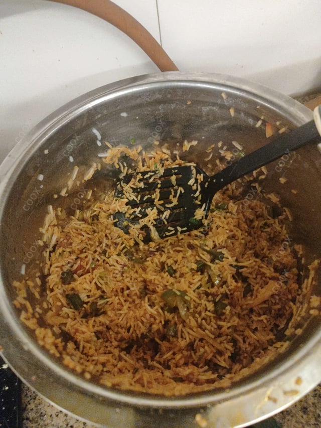 Delicious Schezwan Fried Rice prepared by COOX