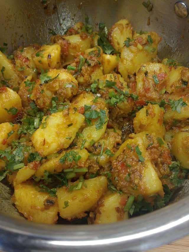 Delicious Jeera Aloo prepared by COOX