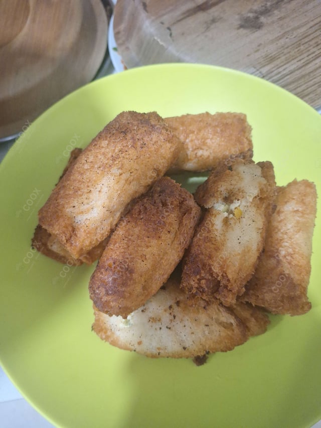 Delicious Dahi ke Sholey prepared by COOX