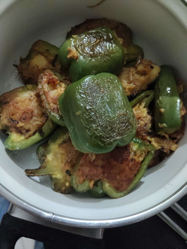 Delicious Bharwa Shimla Mirch prepared by COOX