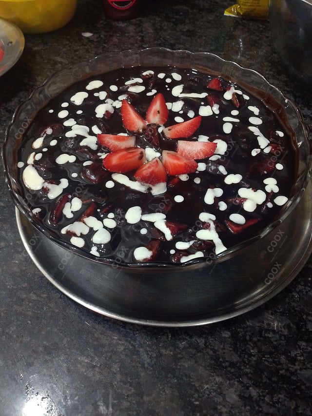 Delicious Melted Chocolate on Strawberries prepared by COOX