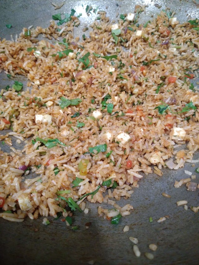 Delicious Schezwan Fried Rice prepared by COOX