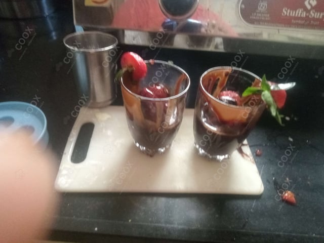 Delicious Melted Chocolate on Strawberries prepared by COOX