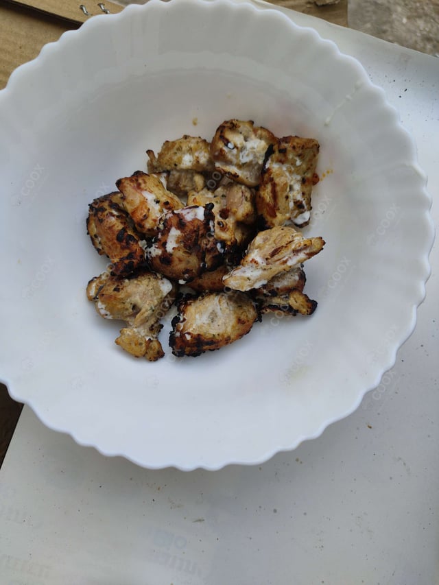 Delicious Murgh Malai Tikka prepared by COOX