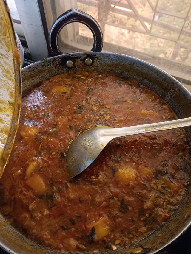 Delicious Aloo Rasedar prepared by COOX