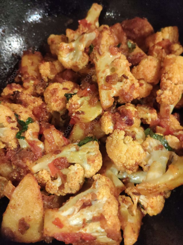 Tasty Aloo Patta Gobhi cooked by COOX chefs cooks during occasions parties events at home