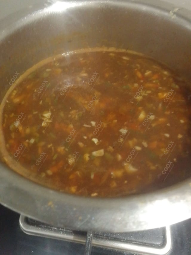 Delicious Vegetable Manchow Soup prepared by COOX