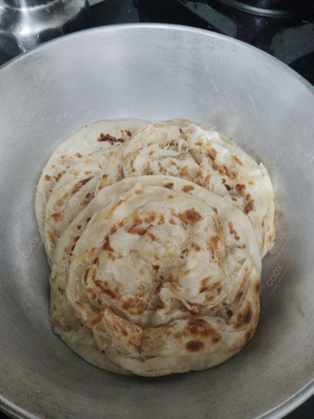 Tasty Malabar Parotta cooked by COOX chefs cooks during occasions parties events at home