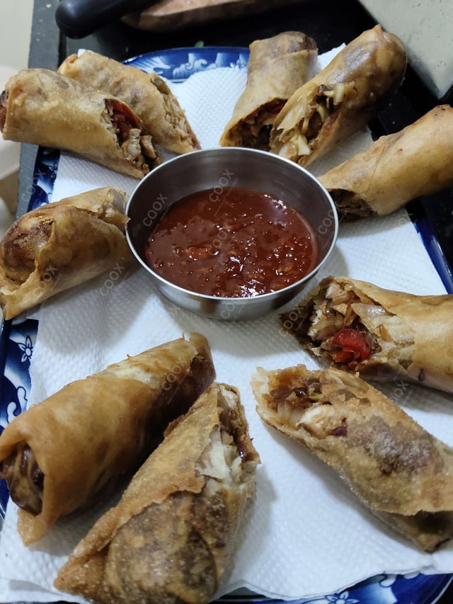 Delicious Chicken Spring Rolls prepared by COOX