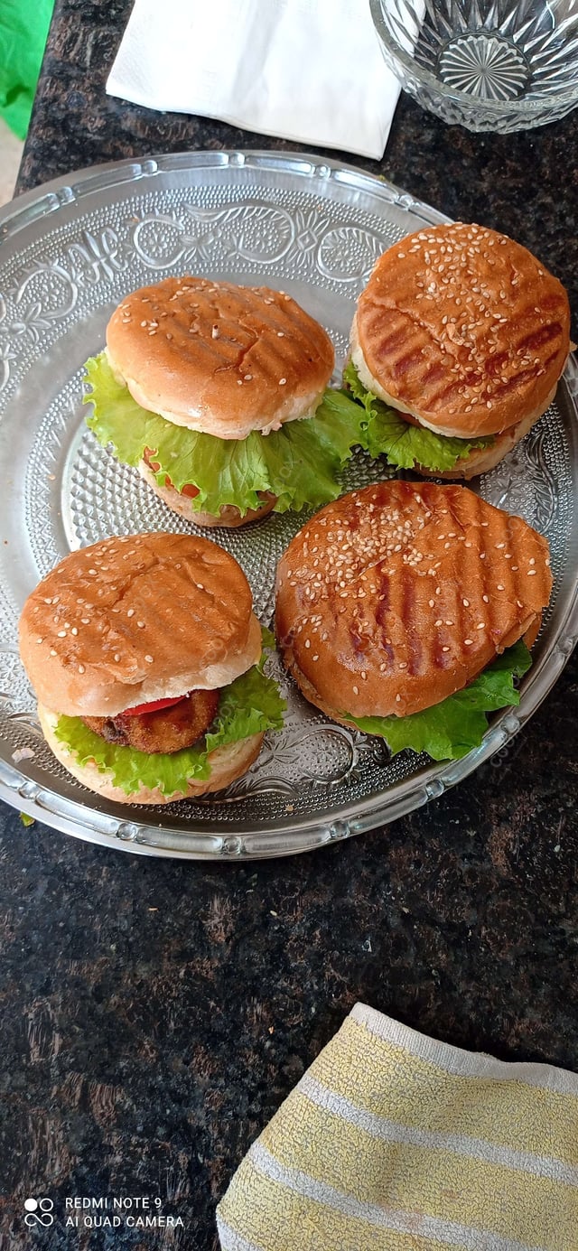 Tasty Mini Veg Burgers cooked by COOX chefs cooks during occasions parties events at home