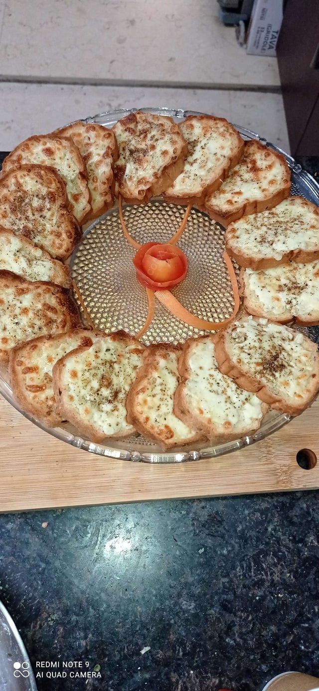 Tasty Garlic Bread with Cheese cooked by COOX chefs cooks during occasions parties events at home