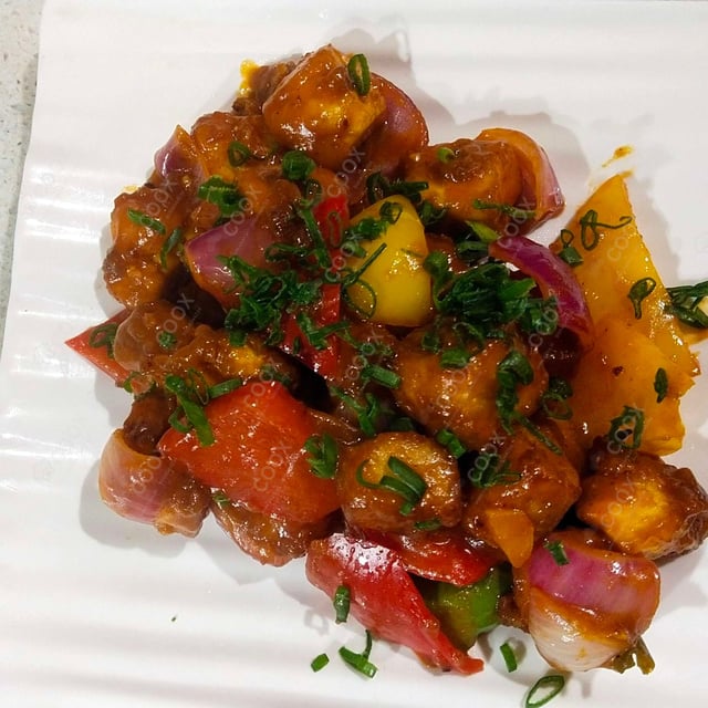 Tasty Chilli Paneer (Dry) cooked by COOX chefs cooks during occasions parties events at home