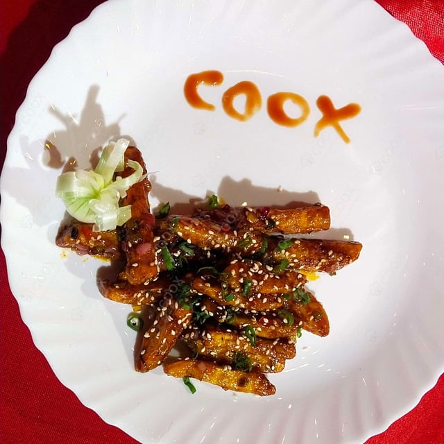 Tasty Honey Chilli Potato cooked by COOX chefs cooks during occasions parties events at home