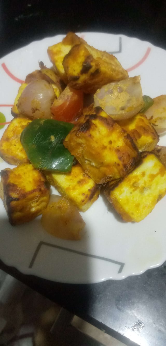 Tasty Paneer Tikka cooked by COOX chefs cooks during occasions parties events at home