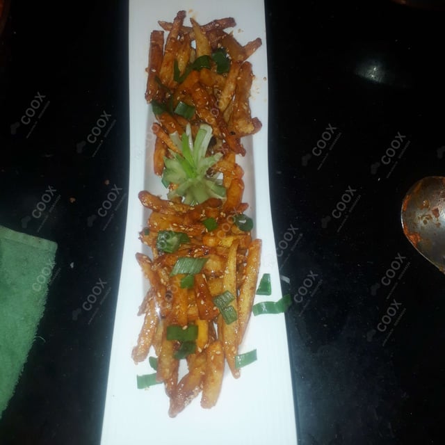 Tasty Honey Chilli Potato cooked by COOX chefs cooks during occasions parties events at home