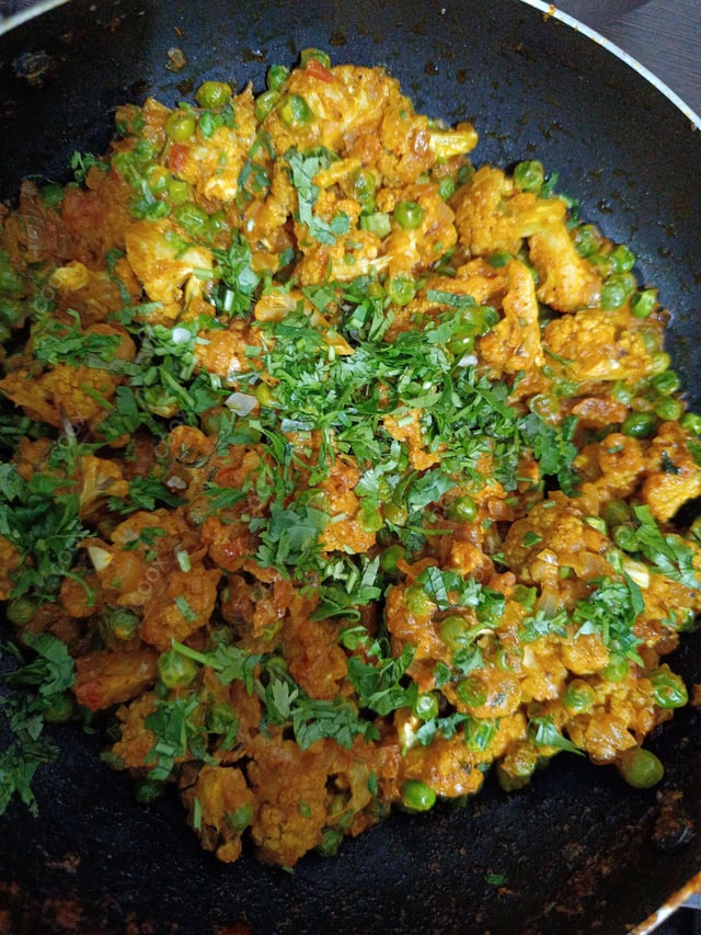 Tasty Gobhi Matar cooked by COOX chefs cooks during occasions parties events at home