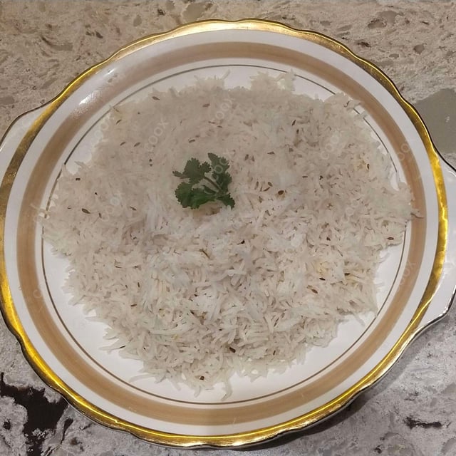 Tasty Jeera Rice cooked by COOX chefs cooks during occasions parties events at home