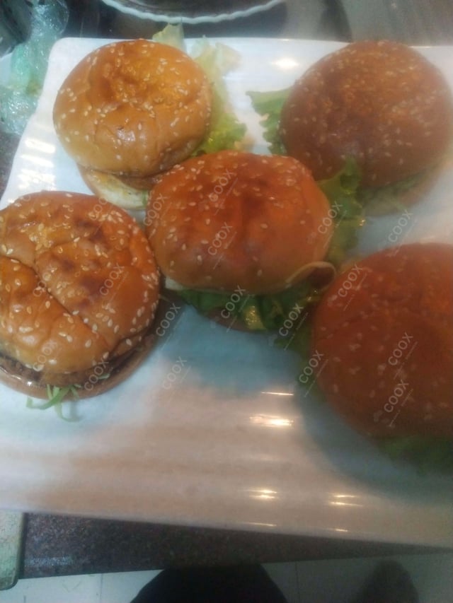 Tasty Chicken Tikka Burgers cooked by COOX chefs cooks during occasions parties events at home