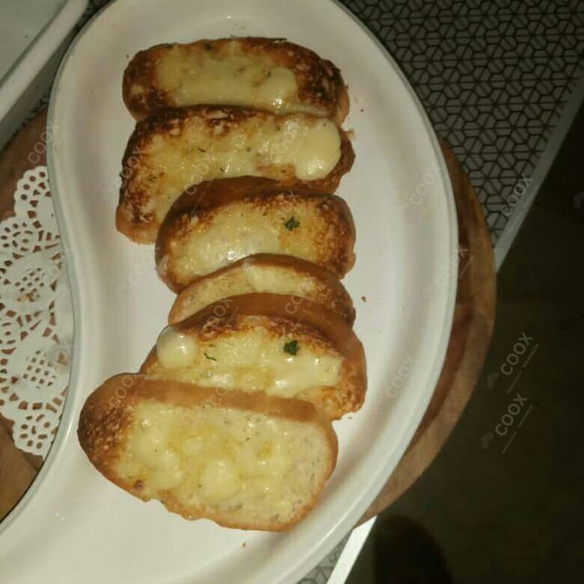 Tasty Garlic Bread with Cheese cooked by COOX chefs cooks during occasions parties events at home