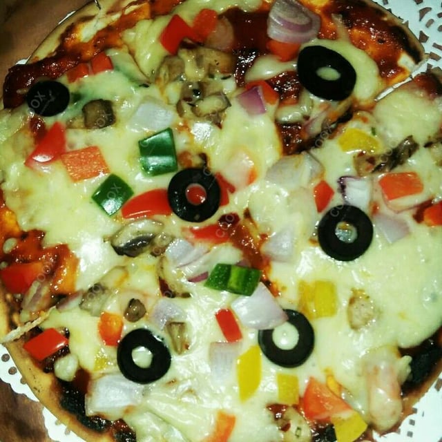 Tasty Veg Pizza cooked by COOX chefs cooks during occasions parties events at home