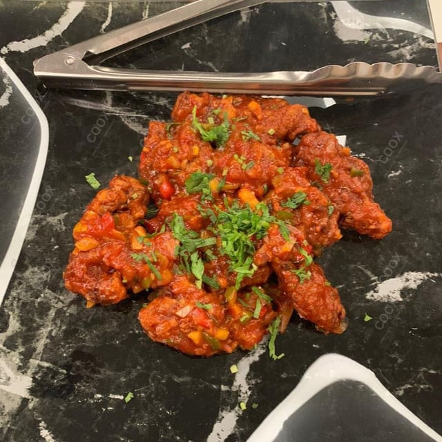 Tasty Chilli  Chicken cooked by COOX chefs cooks during occasions parties events at home