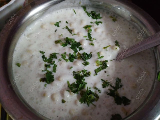 Tasty Boondi Raita cooked by COOX chefs cooks during occasions parties events at home