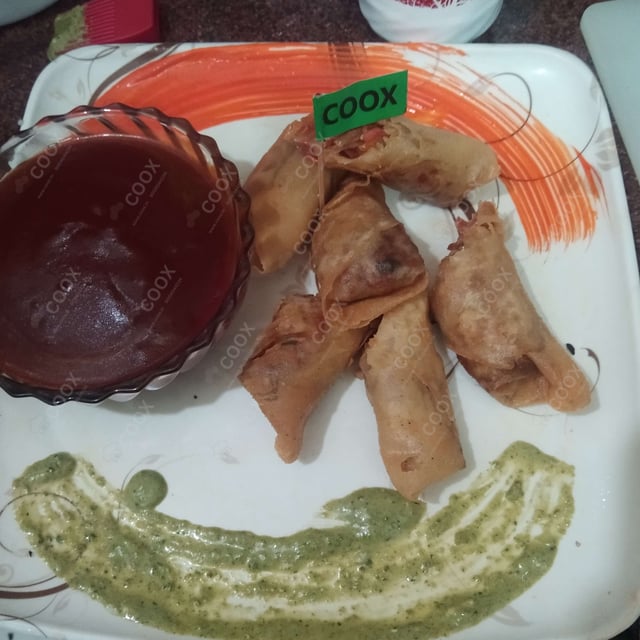Tasty Veg Spring Rolls cooked by COOX chefs cooks during occasions parties events at home