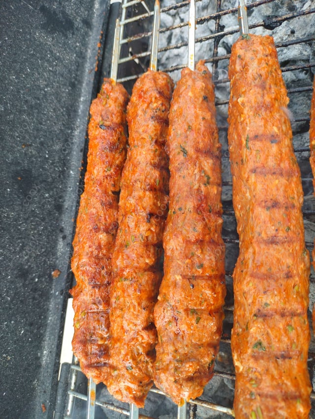 Delicious Mutton Seekh Kebab prepared by COOX