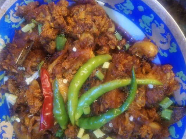 Tasty Aloo Gobhi cooked by COOX chefs cooks during occasions parties events at home