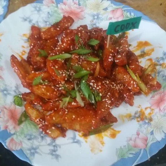 Tasty Honey Chilli Potato cooked by COOX chefs cooks during occasions parties events at home