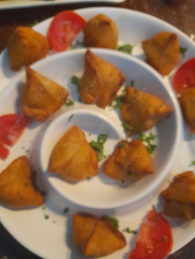 Tasty Mini Samosas cooked by COOX chefs cooks during occasions parties events at home