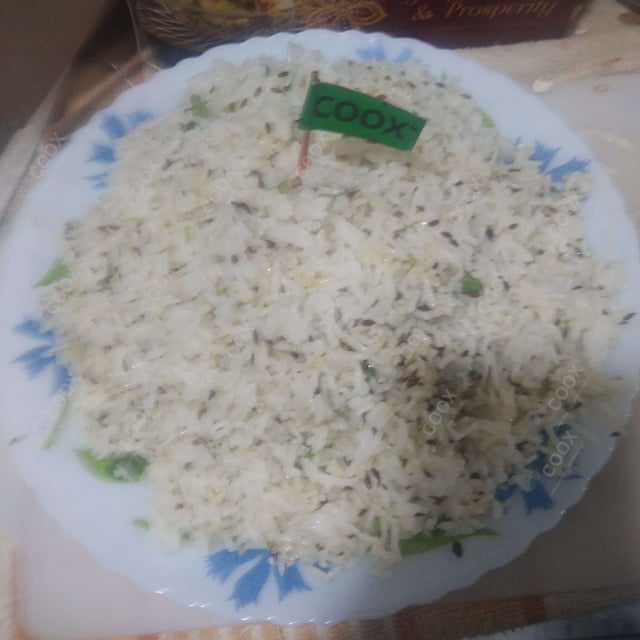 Tasty Jeera Rice cooked by COOX chefs cooks during occasions parties events at home
