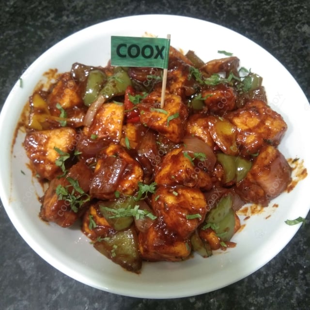 Tasty Chilli Paneer (Dry) cooked by COOX chefs cooks during occasions parties events at home