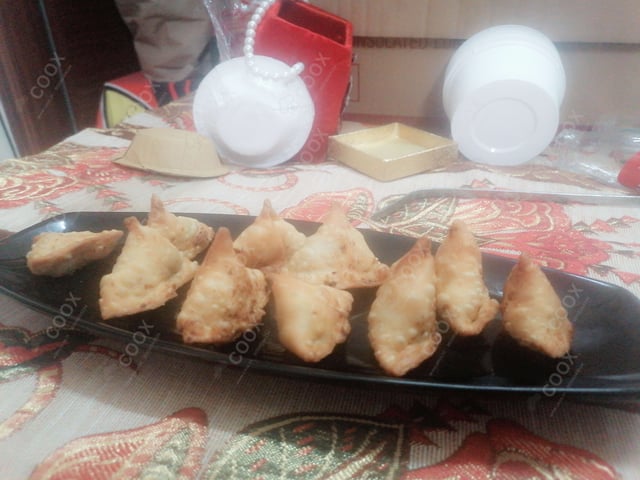 Tasty Mini Samosas cooked by COOX chefs cooks during occasions parties events at home