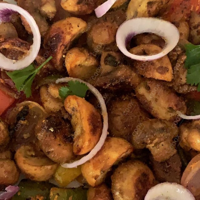 Tasty Mushroom Tikka cooked by COOX chefs cooks during occasions parties events at home