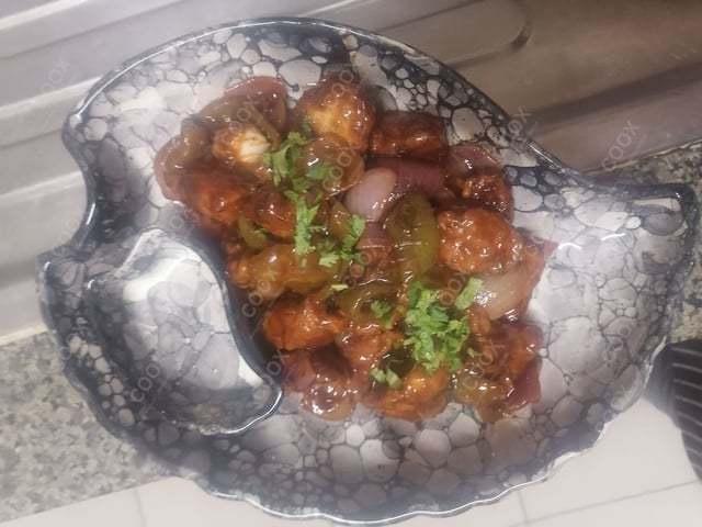 Tasty Chilli Chicken cooked by COOX chefs cooks during occasions parties events at home
