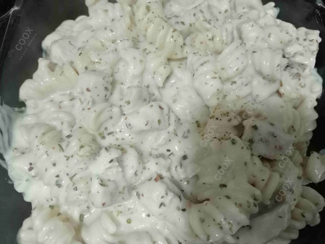 Tasty Chicken Pasta in White Sauce cooked by COOX chefs cooks during occasions parties events at home