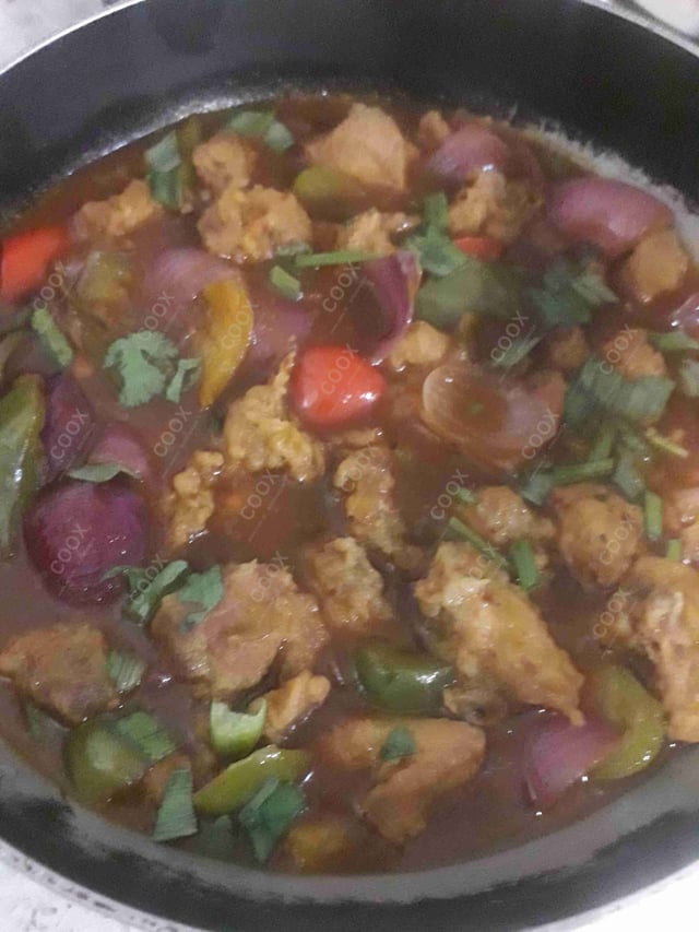 Tasty Chicken in Schezwan Sauce cooked by COOX chefs cooks during occasions parties events at home