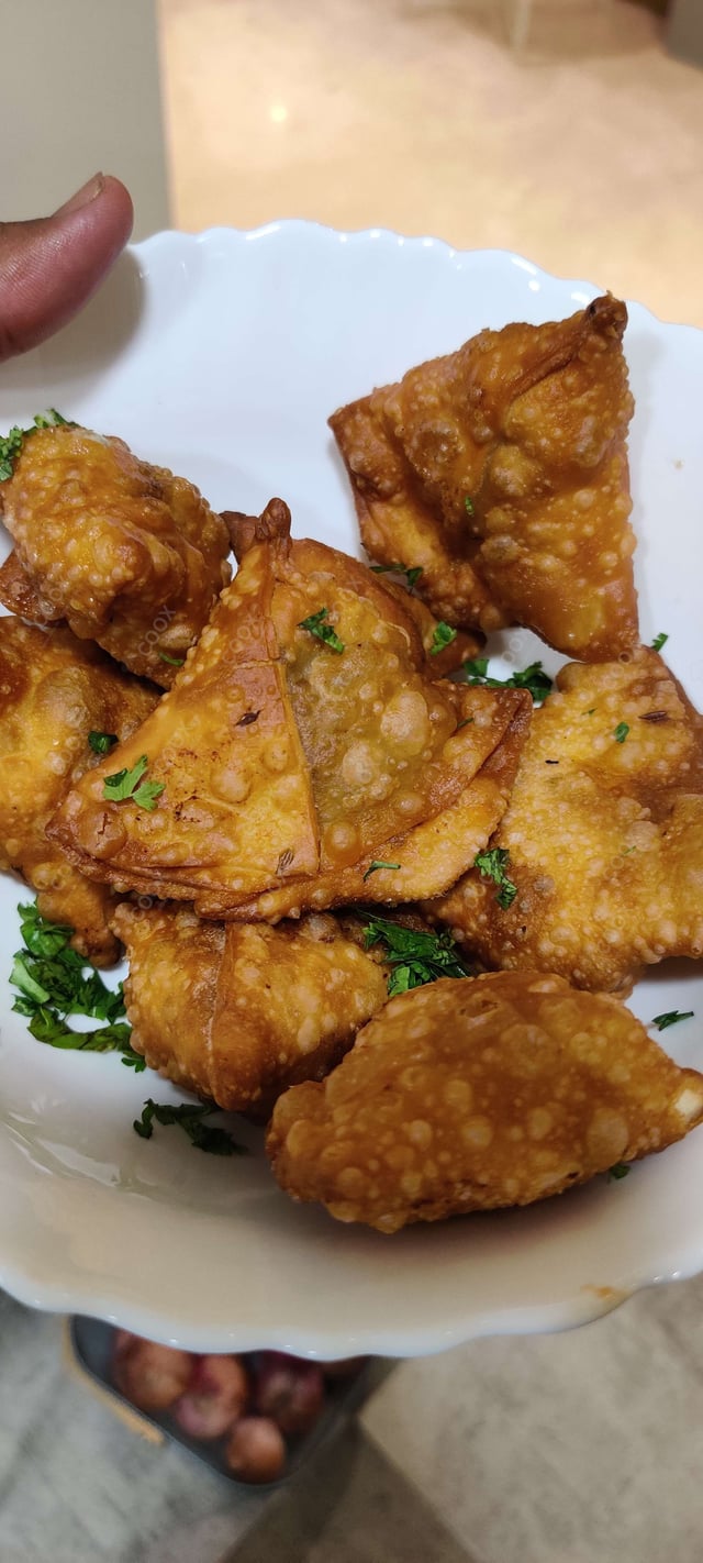 Tasty Mini Samosas cooked by COOX chefs cooks during occasions parties events at home