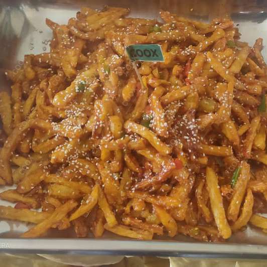 Tasty Honey Chilli Potato cooked by COOX chefs cooks during occasions parties events at home