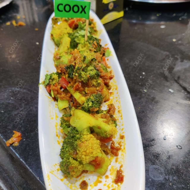 Tasty Masala Broccoli cooked by COOX chefs cooks during occasions parties events at home