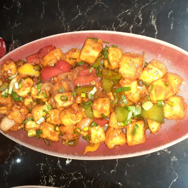 Tasty Chilli Paneer (Dry) cooked by COOX chefs cooks during occasions parties events at home