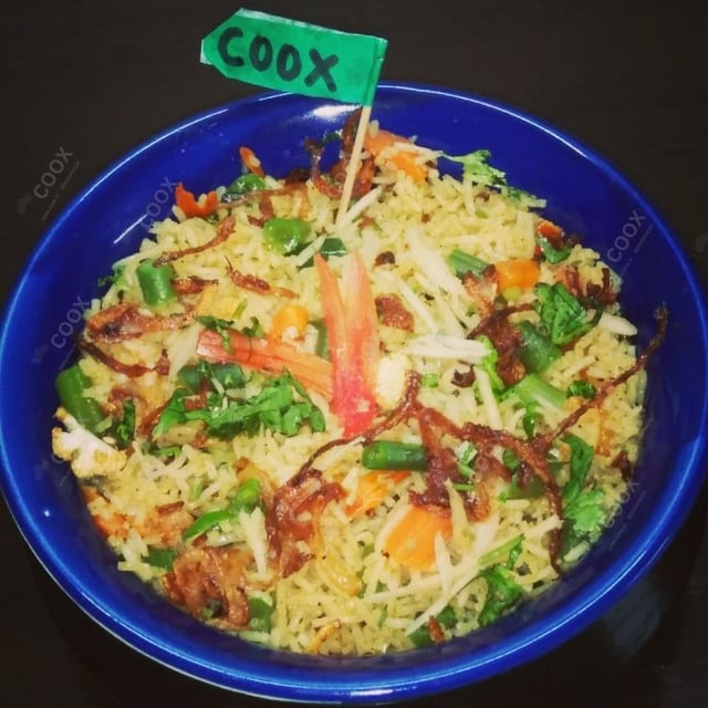Tasty Veg Biryani cooked by COOX chefs cooks during occasions parties events at home