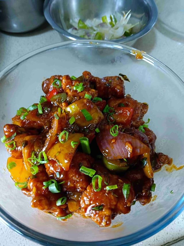Tasty Chicken Manchurian (Dry) cooked by COOX chefs cooks during occasions parties events at home