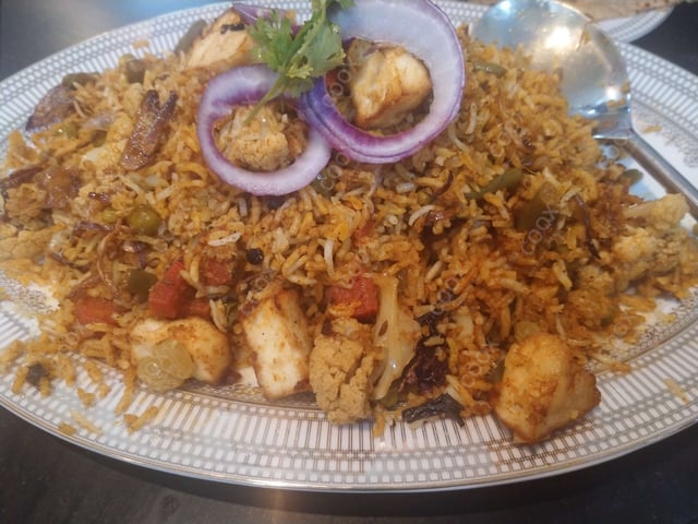 Tasty Veg Biryani cooked by COOX chefs cooks during occasions parties events at home