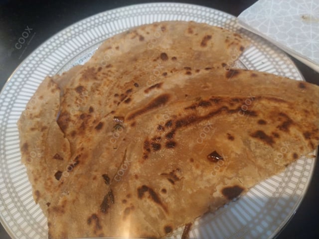 Tasty Lachha Paranthas cooked by COOX chefs cooks during occasions parties events at home