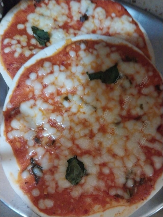 Tasty Margherita Pizza cooked by COOX chefs cooks during occasions parties events at home