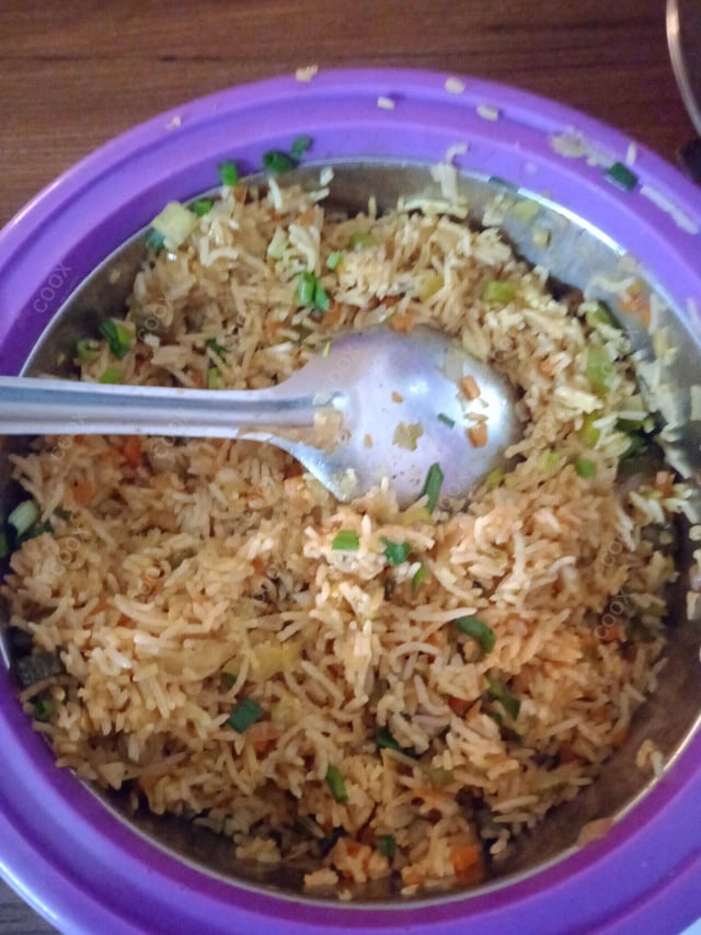 Delicious Schezwan Fried Rice prepared by COOX