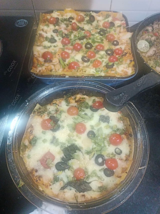 Tasty Chicken Lasagna cooked by COOX chefs cooks during occasions parties events at home