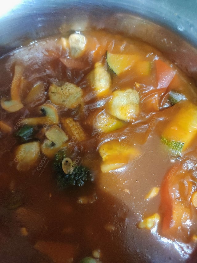 Tasty Mix Veg in Schezwan Sauce cooked by COOX chefs cooks during occasions parties events at home